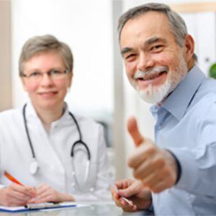 Old man and doctor smiling