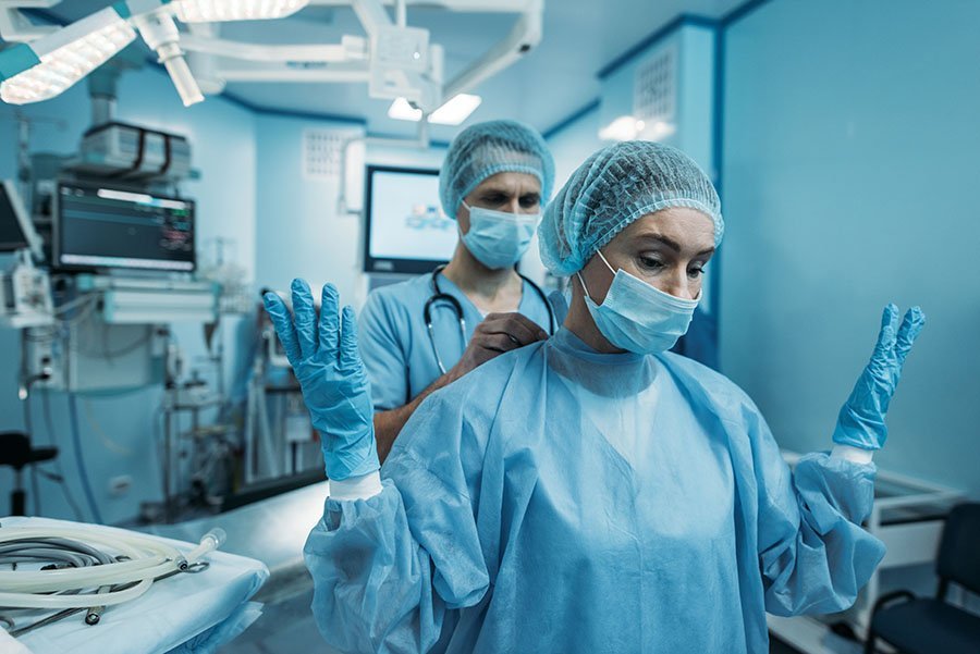 a doctor helping her nurse