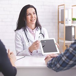 a female doctor showing the result
